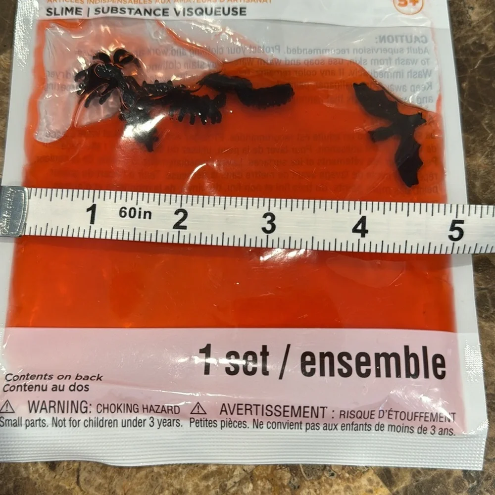35 packets of Slime with creepy crawlers in it. 18 reddish and 17 Blue/purple.